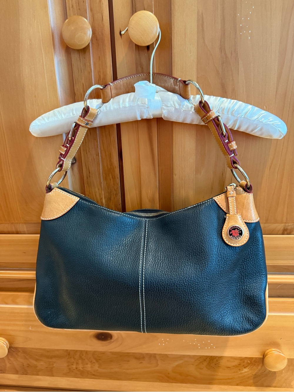 Dooney & Bourke Black Leather Shoulder Bag with Tan Trim and Brown Strap Accents